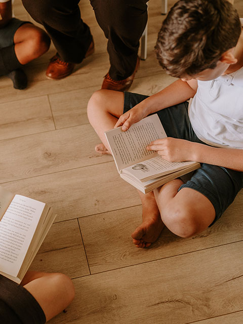 A child reading at Three Peaks School